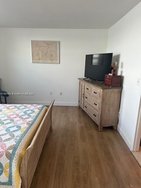 bedroom featuring dark hardwood / wood-style flooring