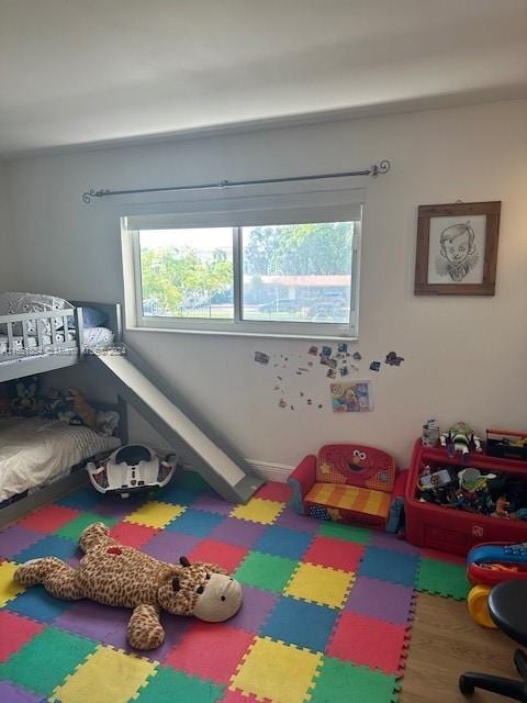 bedroom with hardwood / wood-style flooring