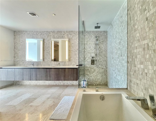 bathroom with independent shower and bath and tile walls