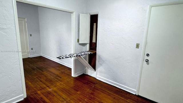 hallway featuring dark hardwood / wood-style flooring