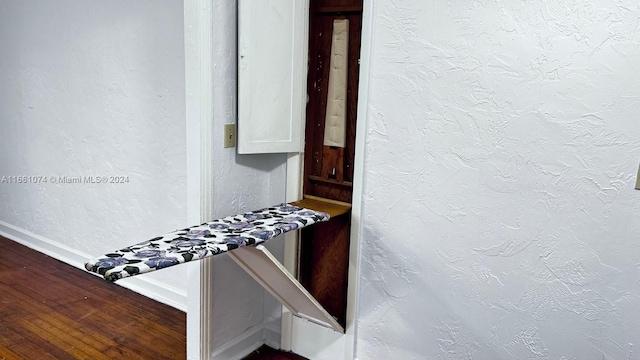 details with wood finished floors and baseboards