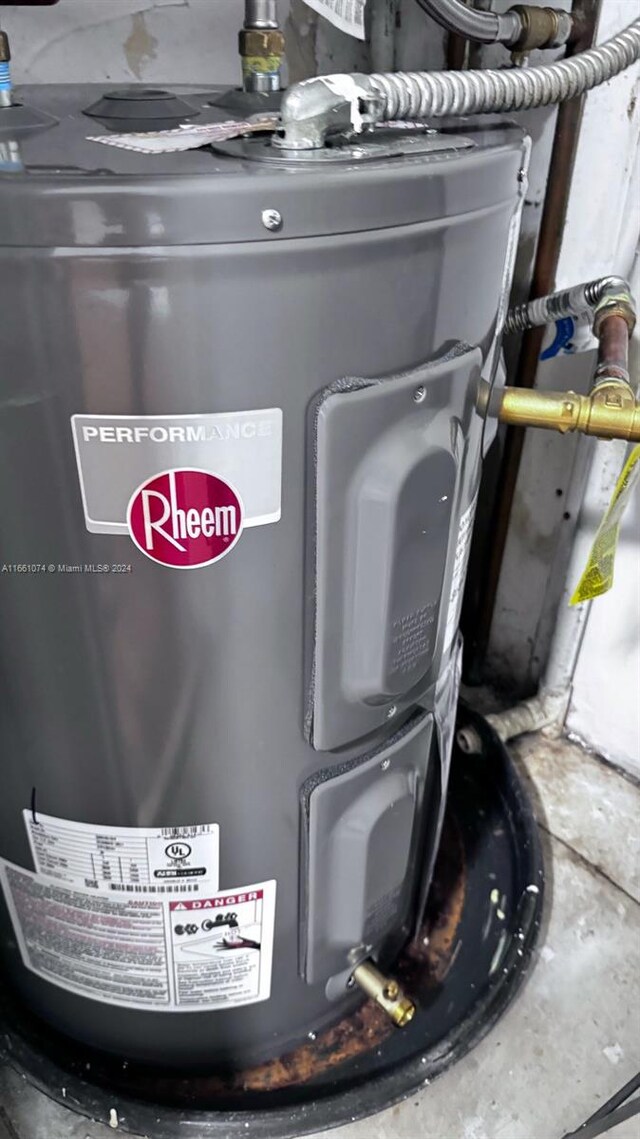 utility room with electric water heater