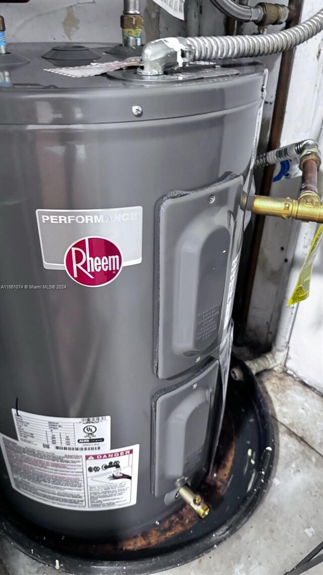 utility room with water heater