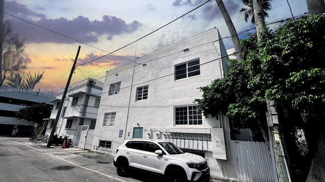 view of outdoor building at dusk