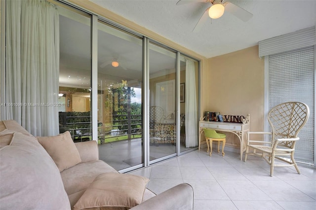 interior space with ceiling fan