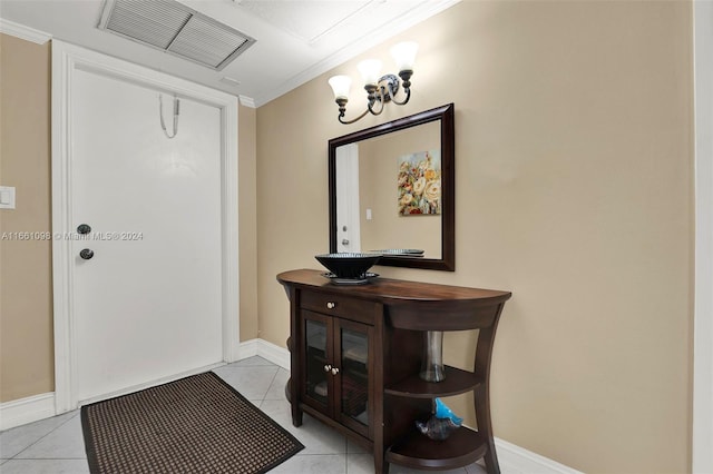 interior space featuring crown molding and light tile patterned floors