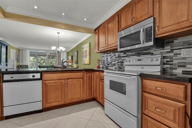 kitchen featuring sink, stove, an inviting chandelier, backsplash, and light tile patterned floors