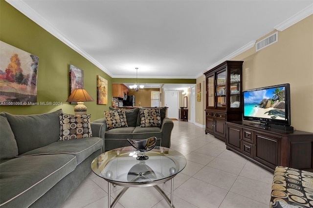 tiled living room featuring crown molding and a notable chandelier