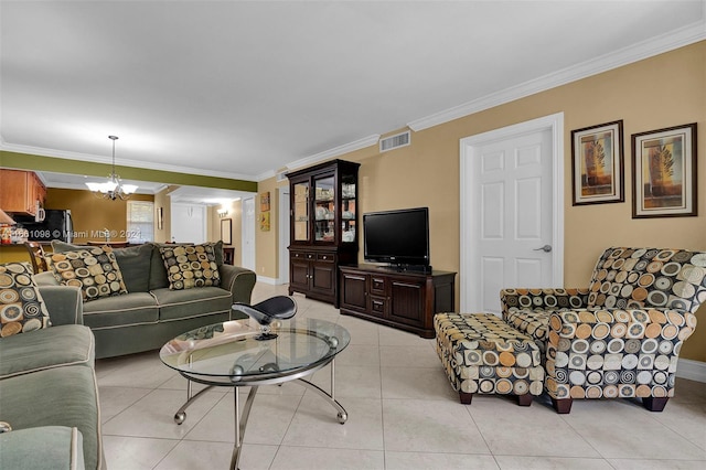 living room with a notable chandelier, ornamental molding, and light tile patterned floors