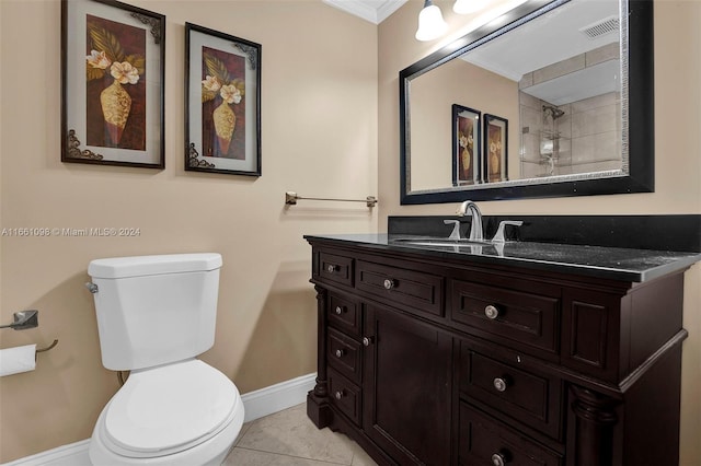 bathroom featuring vanity, crown molding, toilet, and tile patterned flooring