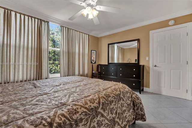 tiled bedroom featuring ceiling fan and crown molding