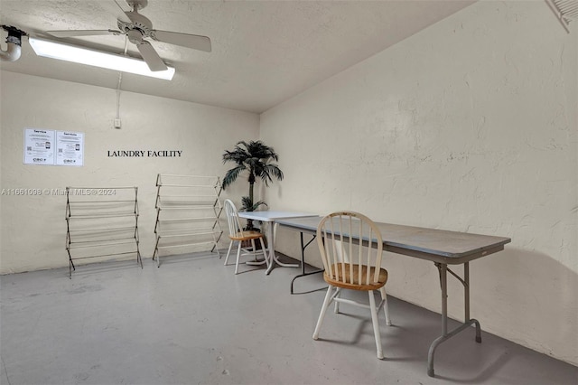 interior space featuring a textured ceiling, ceiling fan, and concrete flooring