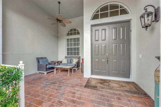 entrance to property featuring ceiling fan