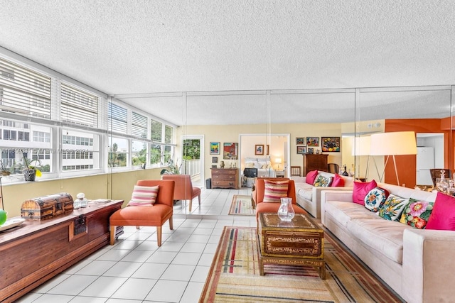 tiled living room featuring a textured ceiling