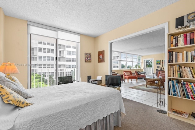 carpeted bedroom with a textured ceiling