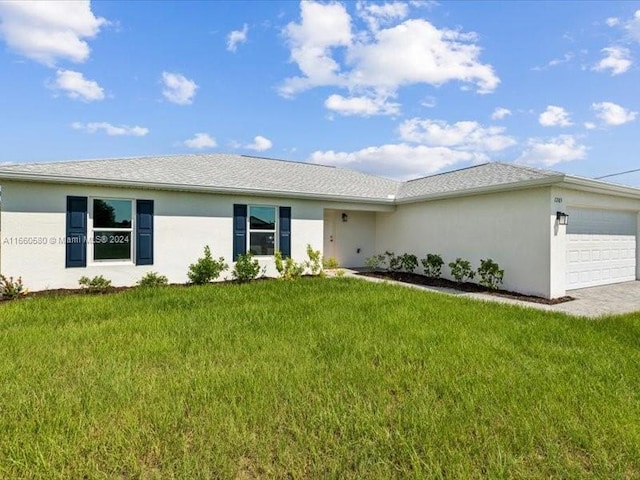 ranch-style home featuring a garage and a front yard