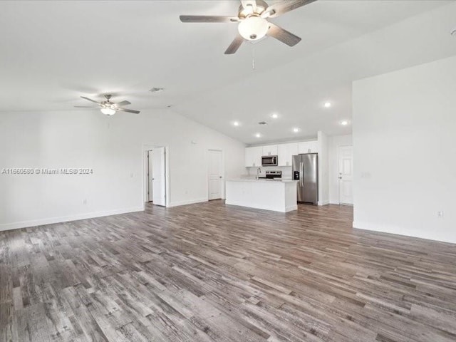 unfurnished living room with vaulted ceiling, ceiling fan, and hardwood / wood-style flooring