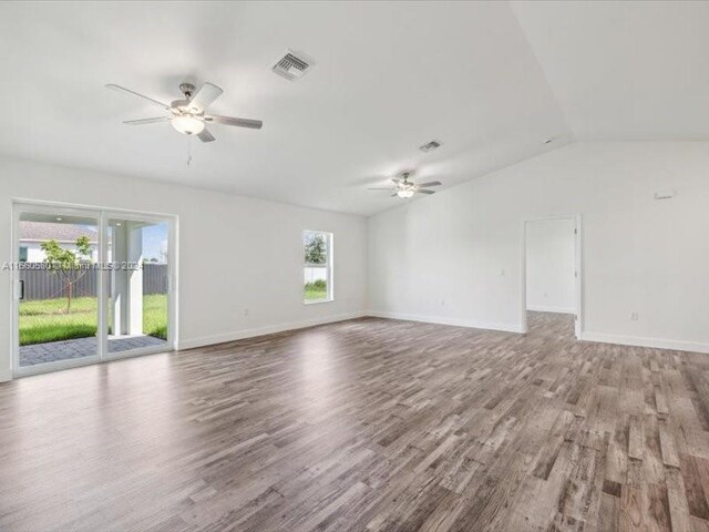 unfurnished living room featuring light wood-type flooring, lofted ceiling, and ceiling fan