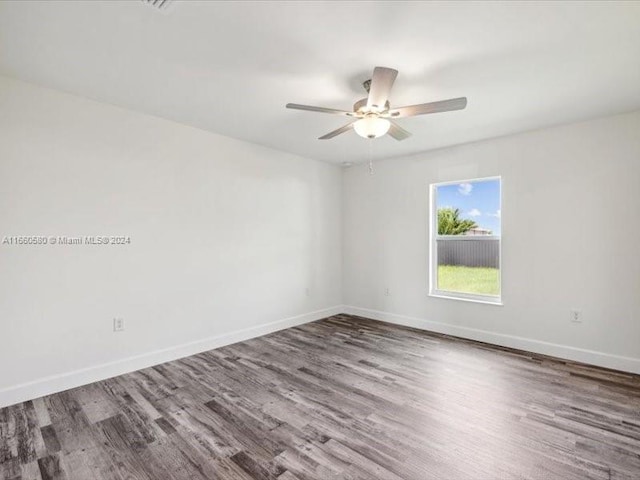 empty room featuring ceiling fan and hardwood / wood-style flooring