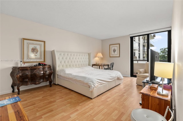 bedroom with hardwood / wood-style flooring