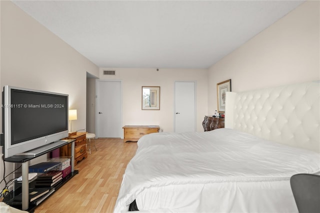 bedroom with light hardwood / wood-style floors