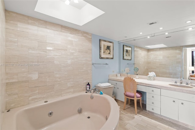 bathroom featuring hardwood / wood-style floors, vanity, a bathtub, and tile walls