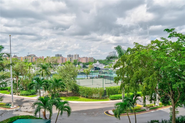 surrounding community featuring tennis court