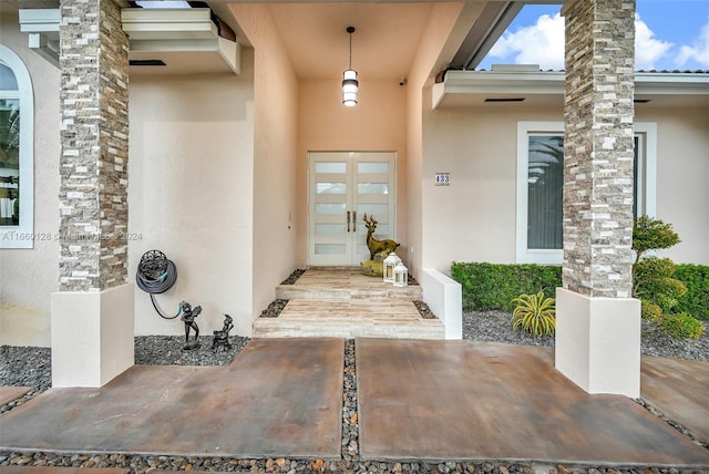 entrance to property featuring french doors