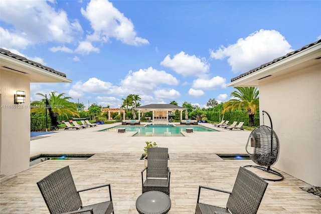 view of swimming pool with a patio area