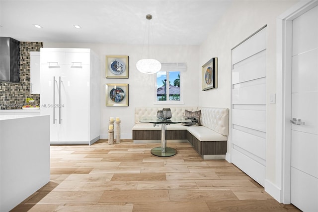 dining room with light wood-type flooring and breakfast area