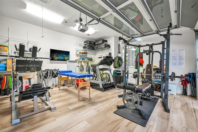 workout room with hardwood / wood-style floors