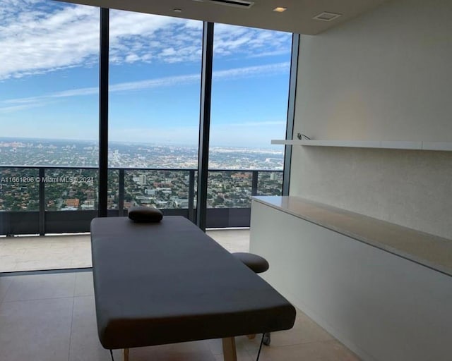 interior space with floor to ceiling windows and light tile patterned flooring