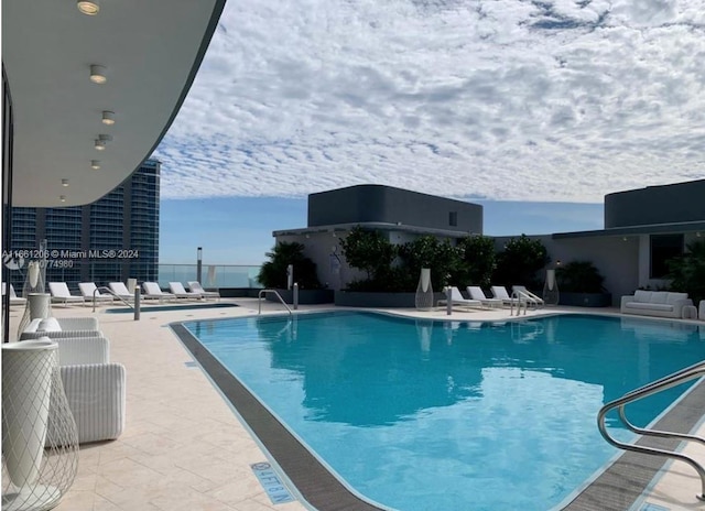 view of pool featuring a patio area