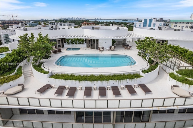 view of swimming pool with a patio area