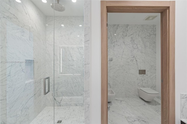 bathroom featuring a bidet, a shower with shower door, and toilet