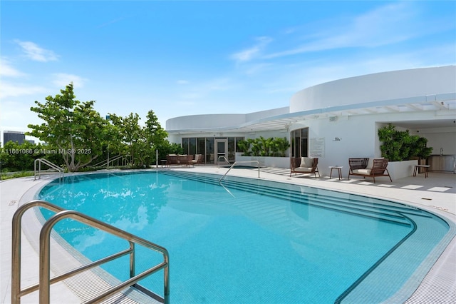 view of pool featuring a patio