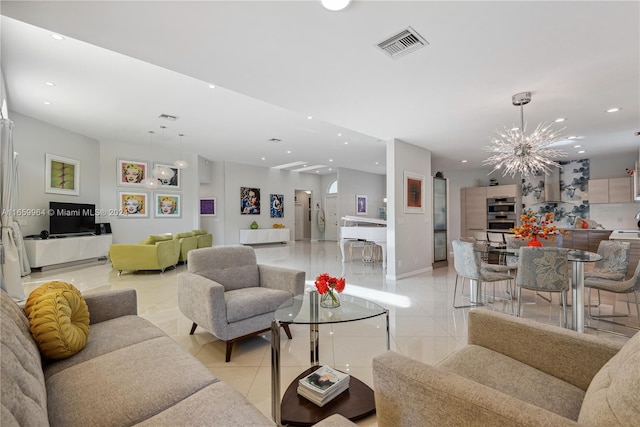 tiled living room with a chandelier