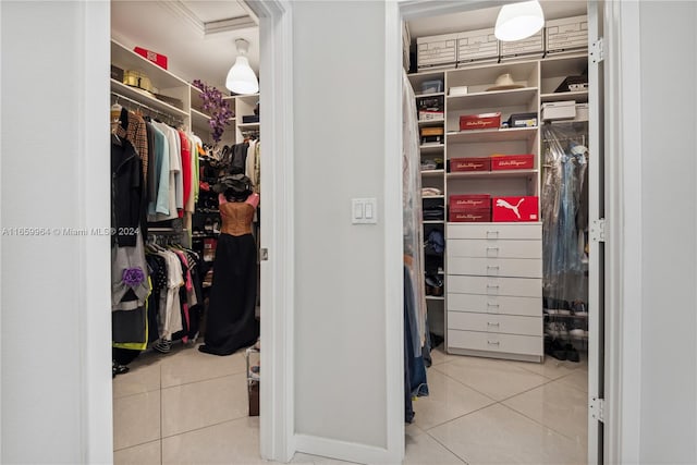 walk in closet with tile patterned floors