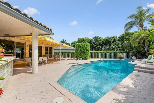 view of swimming pool with a patio area