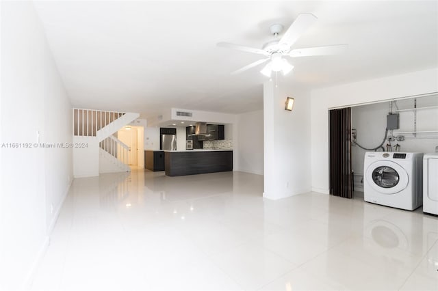 washroom featuring ceiling fan, washer and dryer, and tile patterned floors