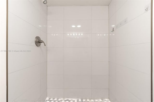 bathroom with a tile shower