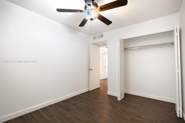 unfurnished bedroom with a closet, ceiling fan, and dark hardwood / wood-style floors