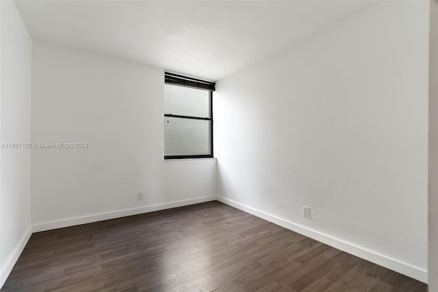 empty room featuring dark hardwood / wood-style floors