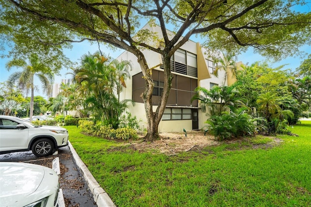 view of home's exterior featuring a yard