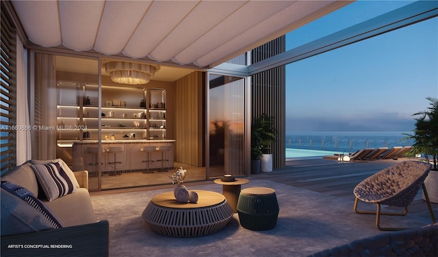 interior space featuring a water view and a balcony