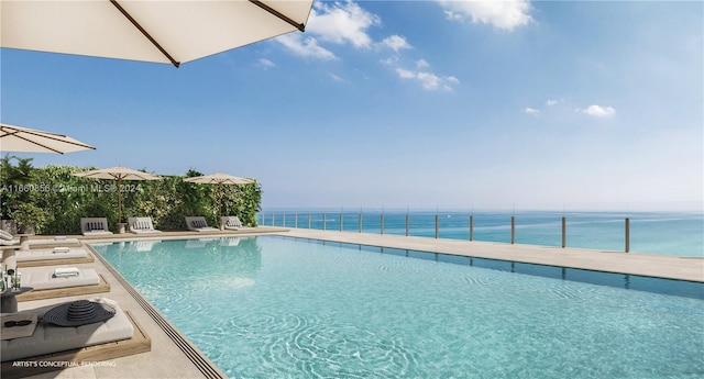 view of pool featuring a water view