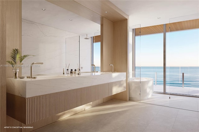 bathroom with floor to ceiling windows, a water view, a bathtub, and vanity