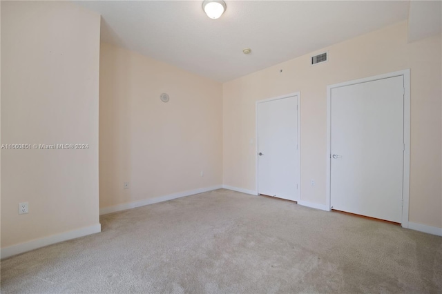 unfurnished bedroom with light carpet