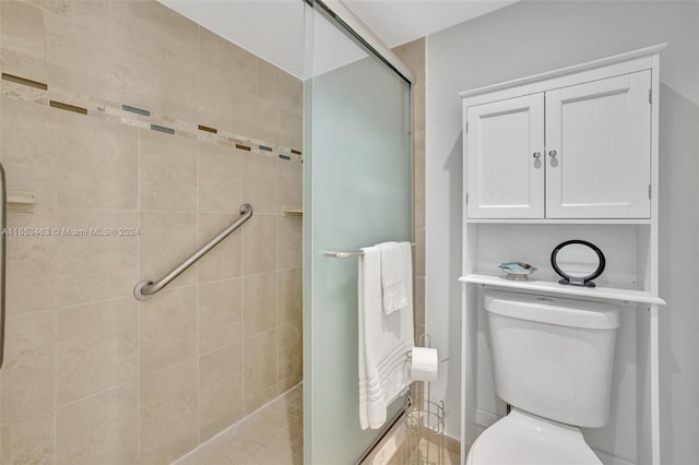 bathroom featuring walk in shower and toilet