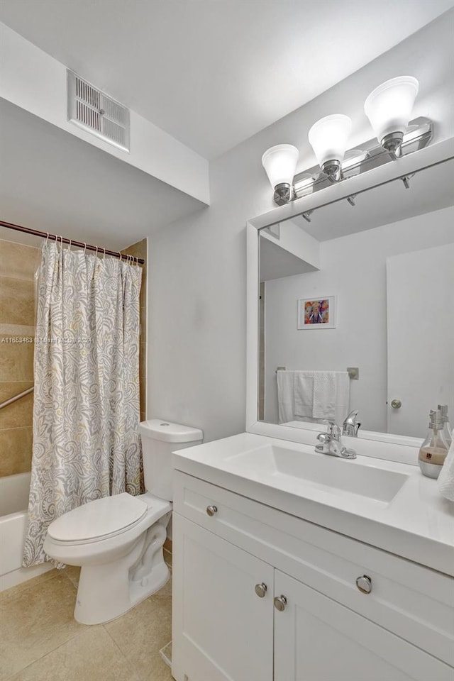 full bathroom with shower / bath combo with shower curtain, tile patterned flooring, vanity, and toilet